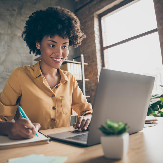 Woman At Desk Virtual Meeting