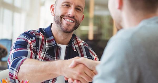 Young Business Partners Shaking Hands